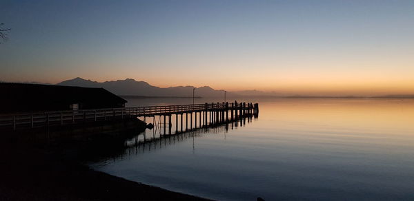 Scenic view of sea against clear sky during sunset