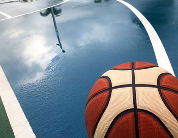 High angle view of basketball in court during rainy season