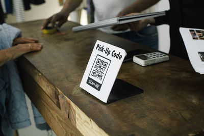 Bar code scanner kept on table at repair shop