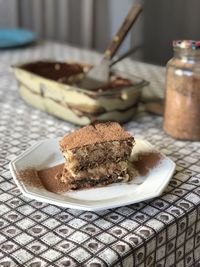 Tiramisu served on a white plate. 