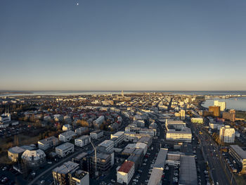 Contemporary city on sea shore in morning