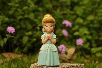 Close-up of figurine toy on field