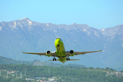 Airplane flying over mountains