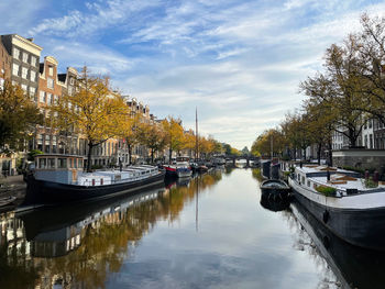 Boats in canal in city