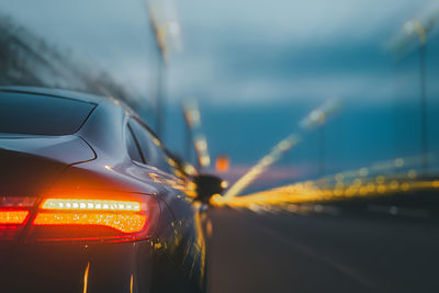 Close-up of car on road at night