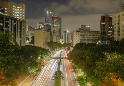 High angle view of illuminated buildings in city at night