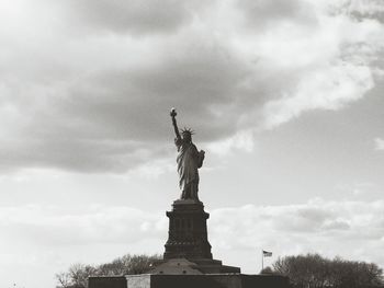 Low angle view of statue against cloudy sky