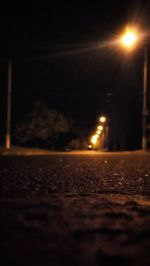 View of illuminated street at night