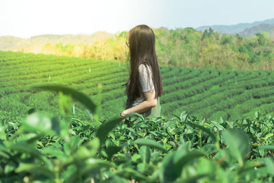 Woman standing in field