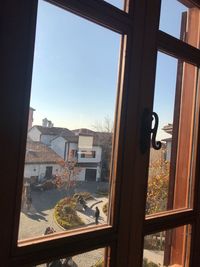 Buildings seen through glass window