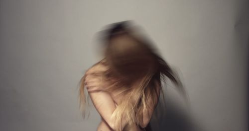 Portrait of woman against white background
