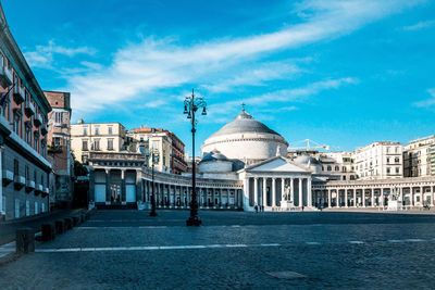 Scenic view of town hall against cloudy sky