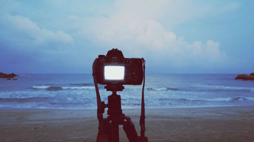 Scenic view of sea against cloudy sky