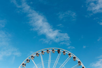 Low angle view of ferris wheel against sky