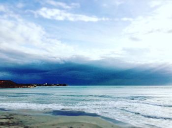 Scenic view of sea against blue sky