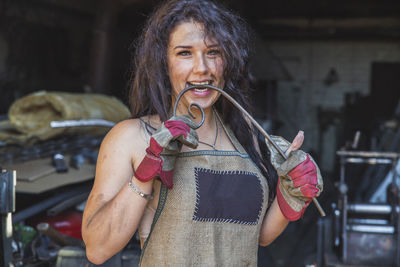 Portrait of young woman drinking water