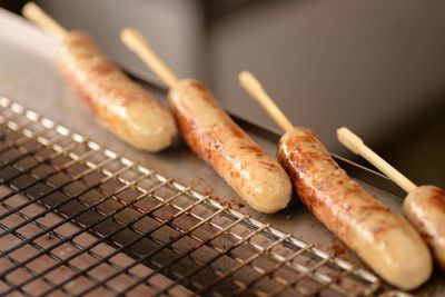 Close-up of sausages on barbecue grill