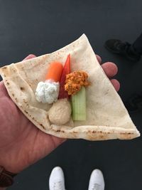 High angle view of hand holding food