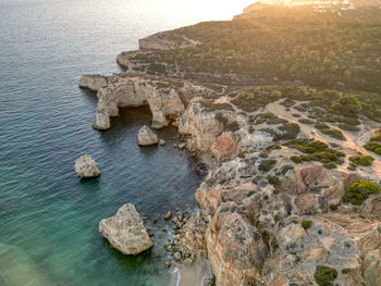 High angle view of rocks on sea