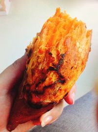 Close-up of hand holding bread