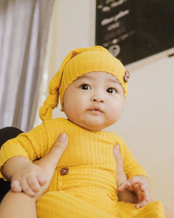 Portrait of cute baby boy wearing hat