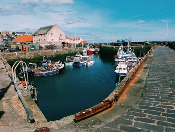 Boats in canal with buildings in background