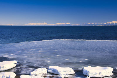 Scenic view of sea against blue sky