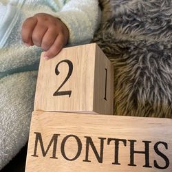 Cropped hand of man holding toy blocks