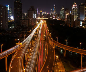 High angle view of illuminated city at night. drone shot of yan'an elevated road in shanghai.