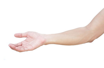 Close-up of hand over white background