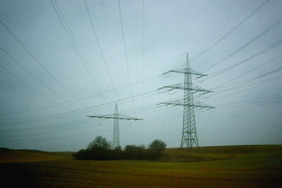 Electricity pylon on field