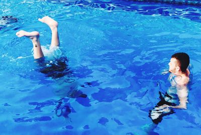 High angle view of men in swimming pool