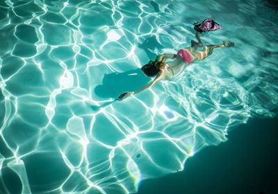 High angle view of person swimming in pool