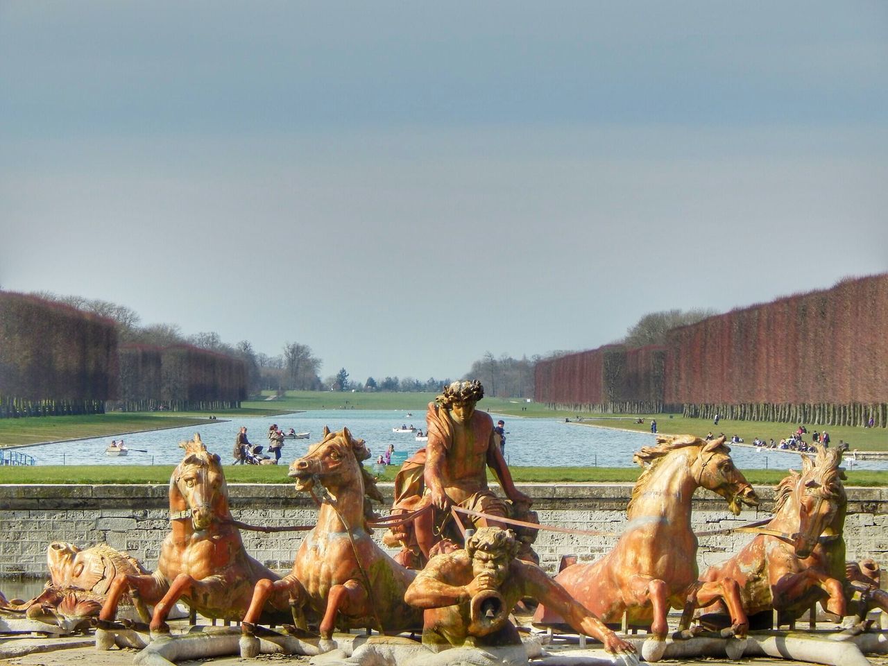 clear sky, animal themes, built structure, building exterior, mammal, architecture, domestic animals, day, sky, tree, outdoors, horse, livestock, copy space, art and craft, statue, no people, incidental people, art, sculpture