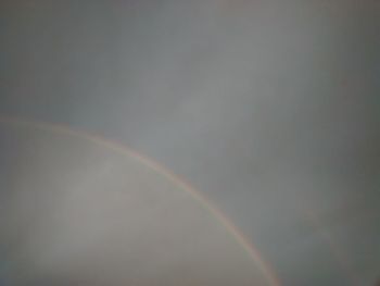 Low angle view of rainbow against sky