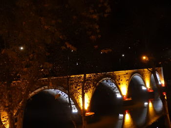 Illuminated arch at night