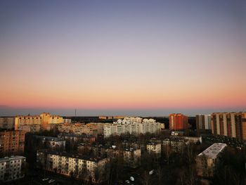 High angle view of buildings against sky during sunset