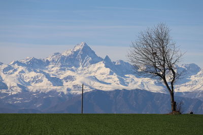 Scenic view of snowcapped mountains against sky