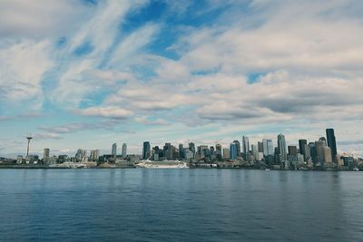 High angle view of city against cloudy sky