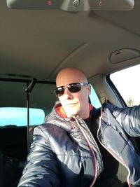 Portrait of young man wearing sunglasses