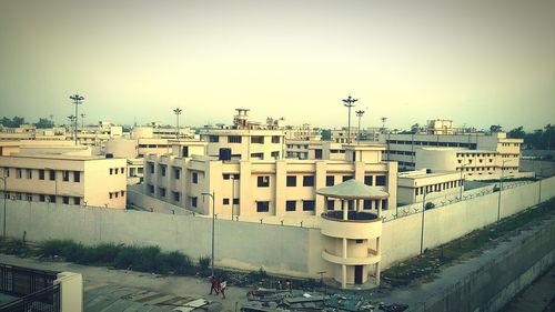 Buildings in city against sky