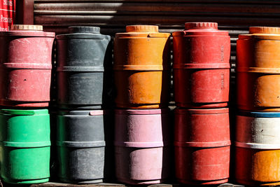 Colorful water carrier kept in the sun, forms abstract design.