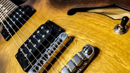 High angle view of guitar on table