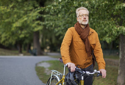 Mature man with bicycle