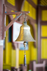 Close-up of electric lamp hanging on table