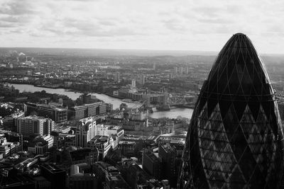 High angle view of city against cloudy sky
