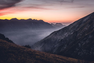 Scenic view of mountains against sky during sunset