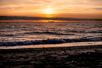 Scenic view of sea against sky during sunset