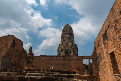 Low angle view of old temple against sky