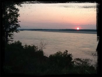 Scenic view of sunset over river